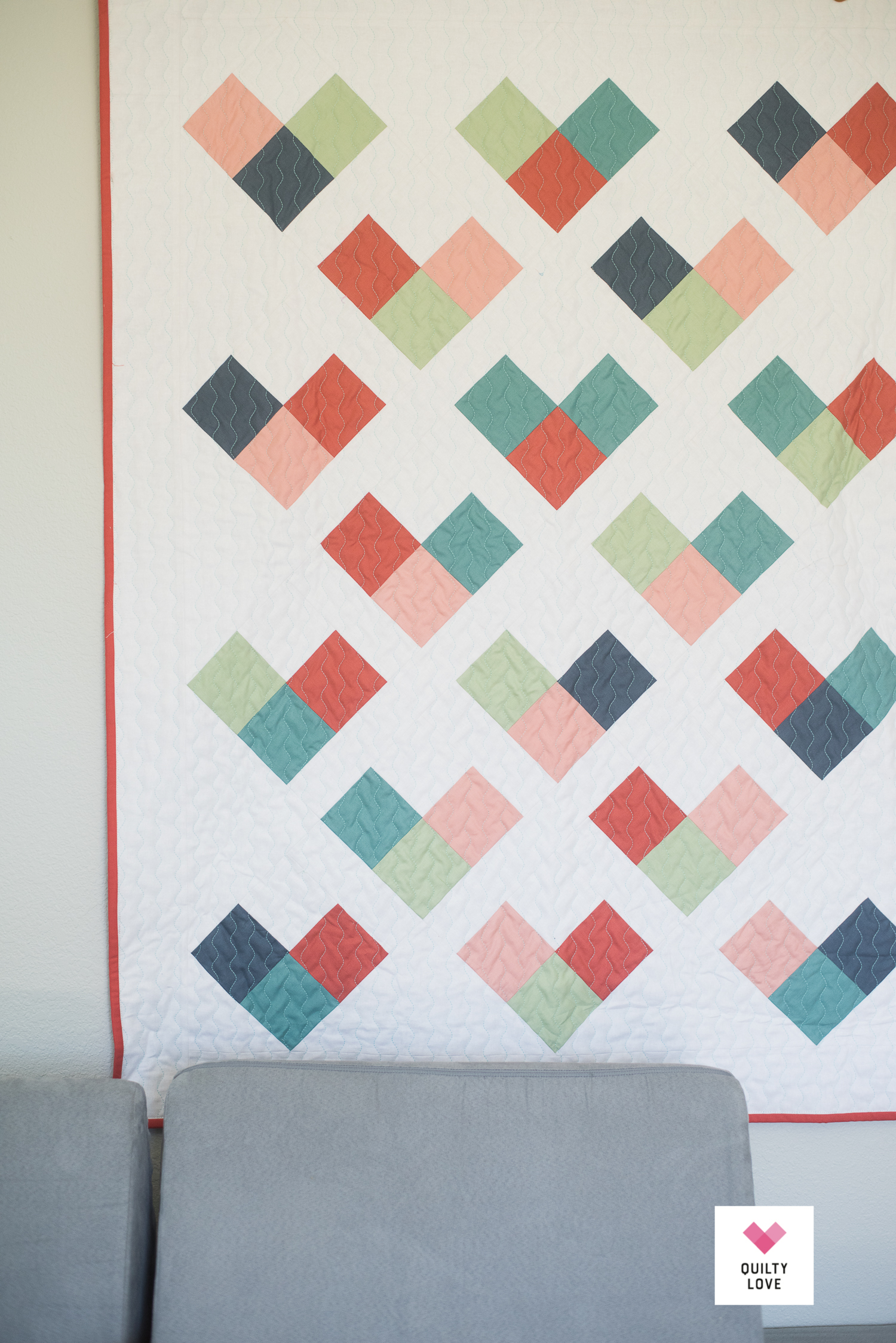 Quilty Hearts baby quilt pattern - The scrappy solids one - Quilty Love